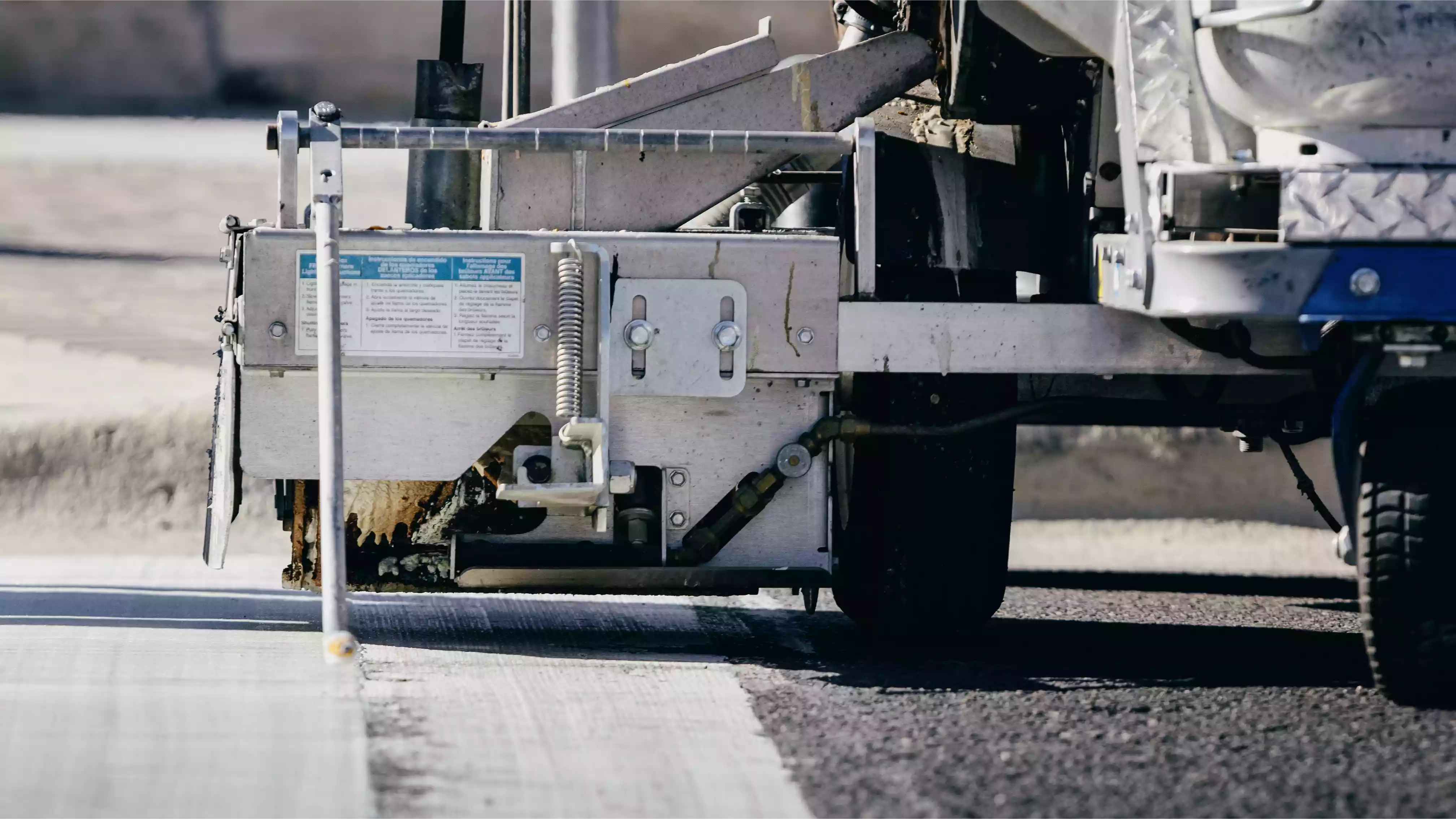 Thermoplastic crosswalk markings being applied over powdered forms in Georgetown, Texas