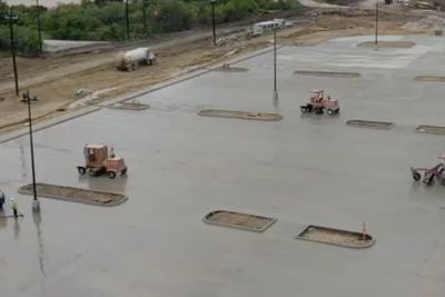 Aerial view of concrete paving at a large warehouse facility parking lot in San Antonio, Texas
