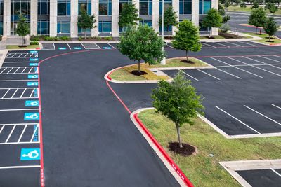 Fresh parking lot markings applied to a commercial parking lot