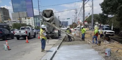 Stripe-It-Up crew pouring a concrete sidewalk in Austin, TX