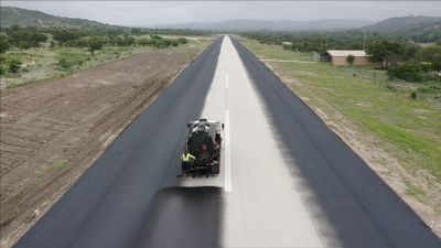 Sealcoat is being applied to a runway