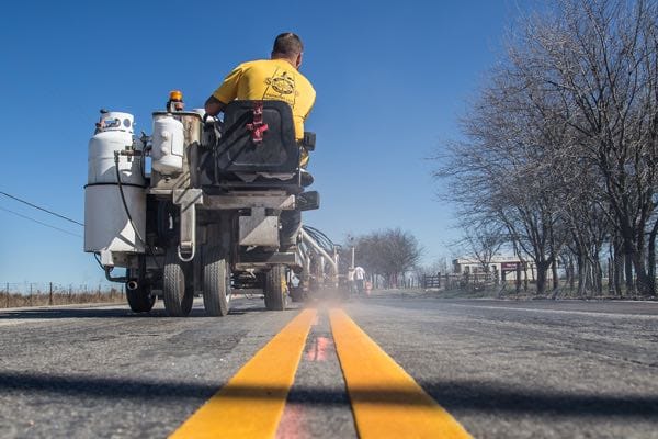 Our crews applying double-yellow highway lanes