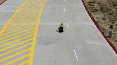 Aerial view of fresh markings applied to a concrete roadway